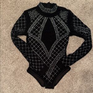 Size small beaded black body suit. High neck long sleeves.